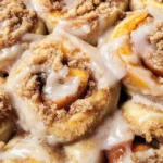 Peach Cobbler Cinnamon Rolls with Crumb Topping